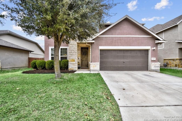 view of front of home featuring a garage and a front yard