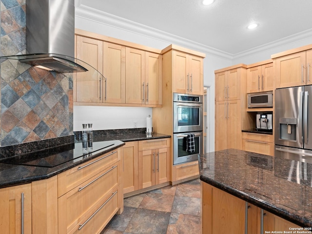 kitchen with crown molding, appliances with stainless steel finishes, dark stone counters, and wall chimney exhaust hood