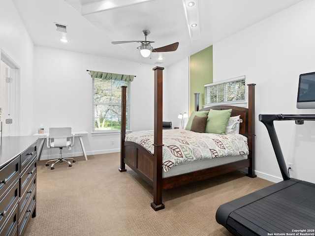 bedroom featuring ceiling fan and light carpet