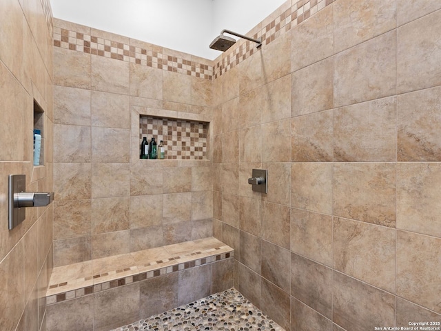 bathroom with tiled shower