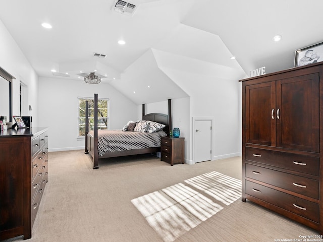 carpeted bedroom featuring lofted ceiling