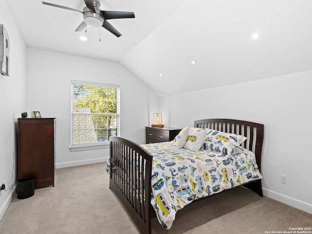 carpeted bedroom with vaulted ceiling and ceiling fan