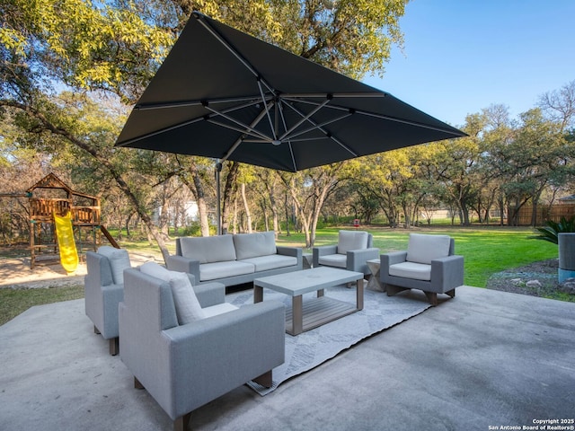 view of patio with a playground and outdoor lounge area