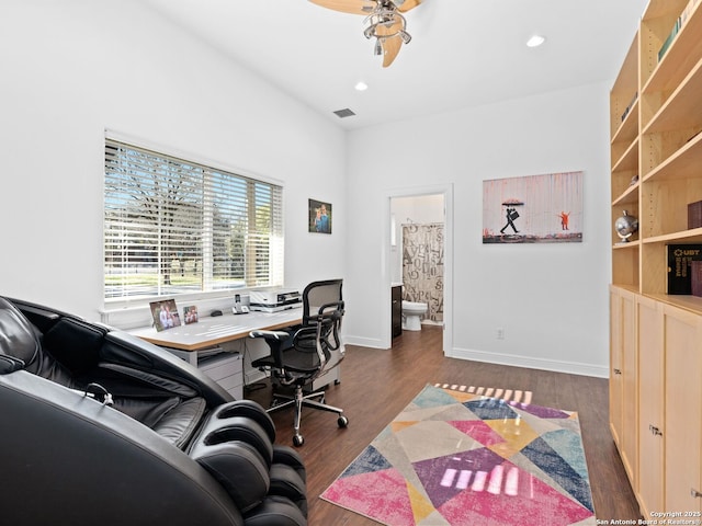 office space featuring dark hardwood / wood-style floors and ceiling fan