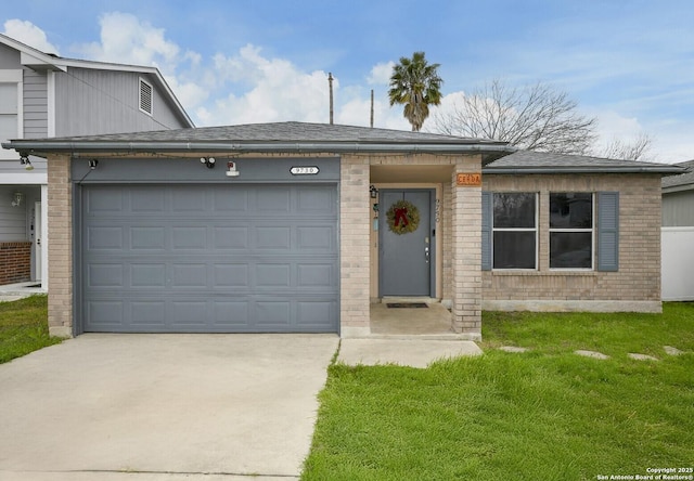 view of front of house with a garage and a front yard