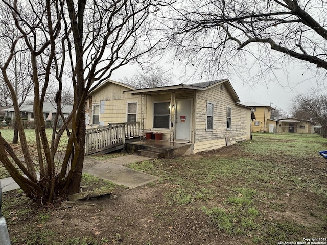 view of property exterior featuring a lawn