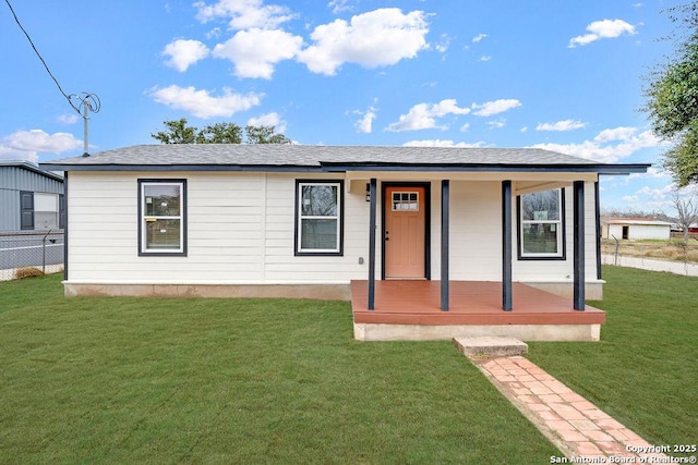 view of front of house with a front yard and covered porch