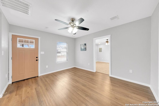 foyer entrance featuring ceiling fan and light wood-type flooring