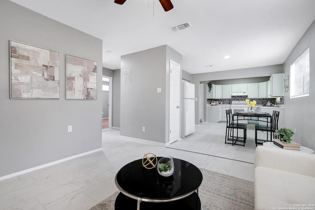 living room with ceiling fan