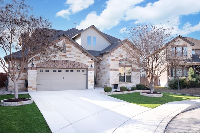 view of front facade with a garage and a front lawn