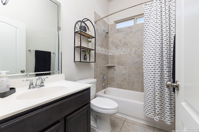 full bathroom featuring vanity, tile patterned floors, toilet, and shower / bath combo with shower curtain