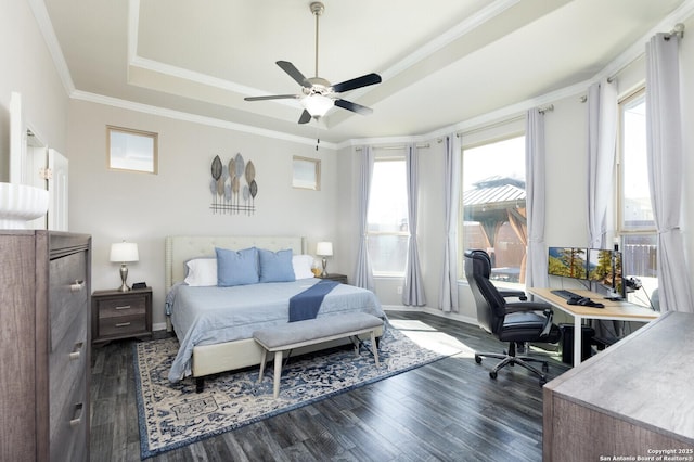 bedroom with a raised ceiling, ornamental molding, and dark wood-type flooring