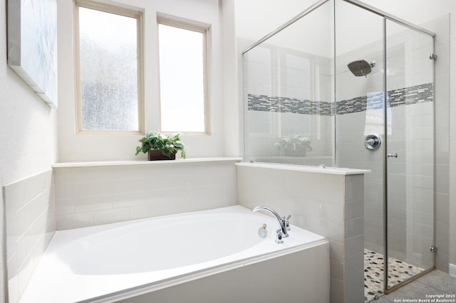 bathroom with independent shower and bath