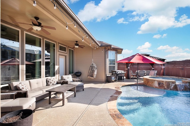 view of swimming pool with a patio area, a gazebo, outdoor lounge area, an in ground hot tub, and ceiling fan