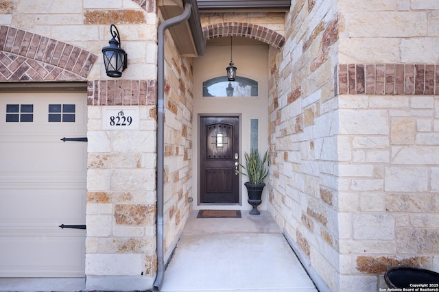 property entrance with a garage