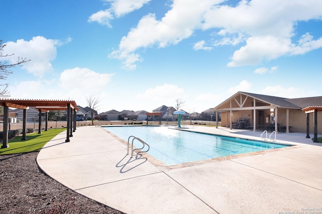 view of swimming pool featuring a pergola and a patio area