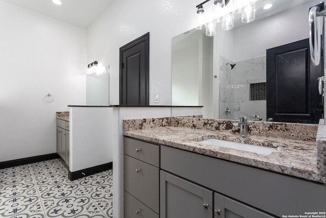 bathroom with a shower and vanity