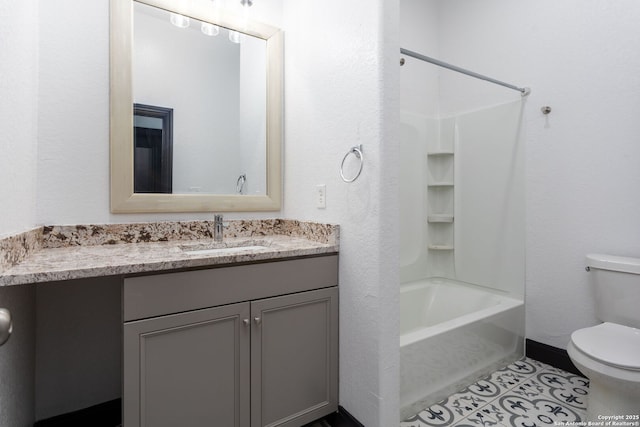 full bathroom featuring shower / bath combination, vanity, tile patterned floors, and toilet