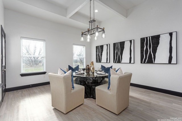 dining area with beamed ceiling and wood-type flooring