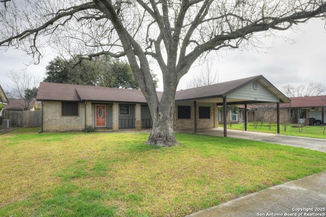 single story home featuring a front yard and a carport