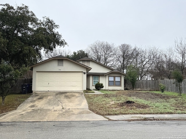 13066 Feather Rdg, San Antonio, TX 78233 - ranch-style house featuring fence, driveway, stucco siding, and an attached garage