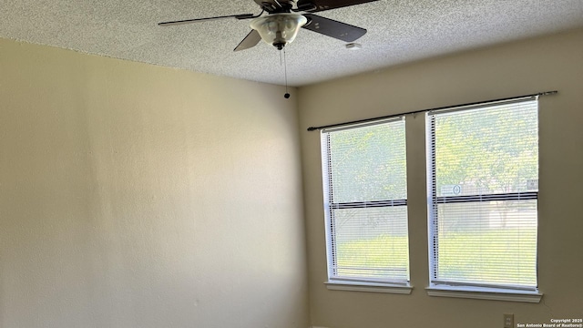13066 Feather Rdg, San Antonio, TX 78233 - unfurnished room with a textured ceiling, plenty of natural light, and a ceiling fan