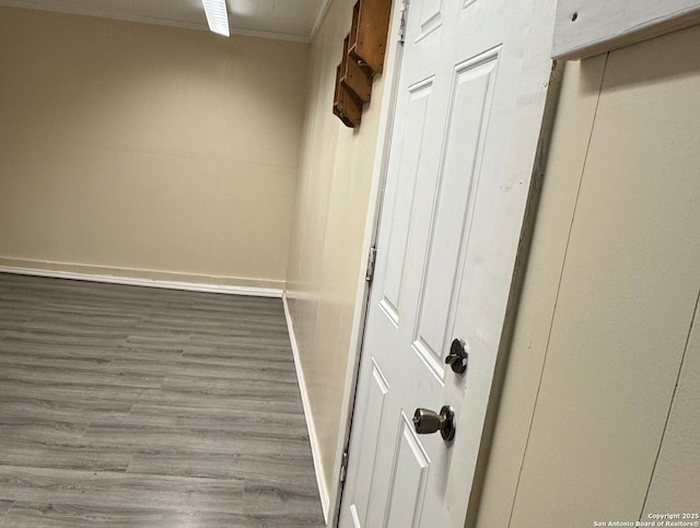 interior space with dark wood-type flooring and ornamental molding