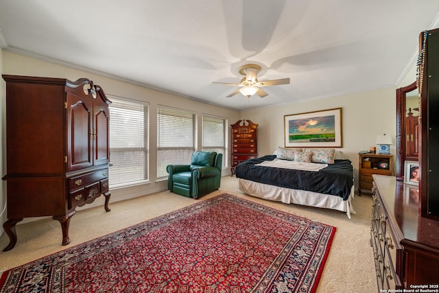 bedroom featuring light carpet, ceiling fan, and ornamental molding