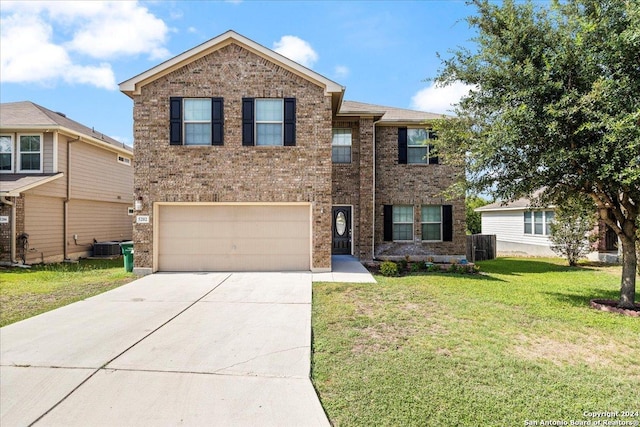 view of front of house with a garage and a front yard