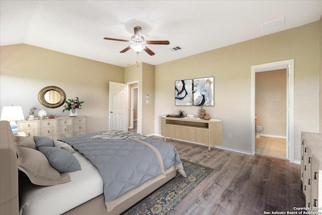 bedroom with hardwood / wood-style flooring, ceiling fan, lofted ceiling, and ensuite bath