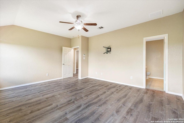 empty room featuring ceiling fan, wood-type flooring, and lofted ceiling