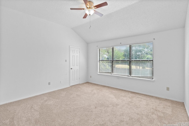 25002 Silverstone, San Antonio, TX 78258 - empty room with light colored carpet, ceiling fan, a textured ceiling, and lofted ceiling