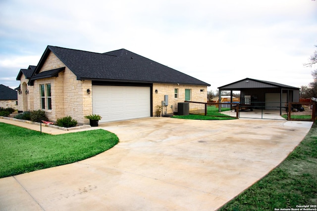 view of front of home with central AC unit and a front yard