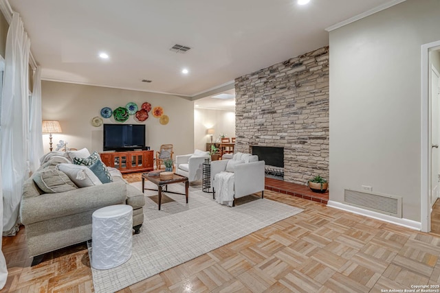 living room featuring light parquet floors, crown molding, and a stone fireplace