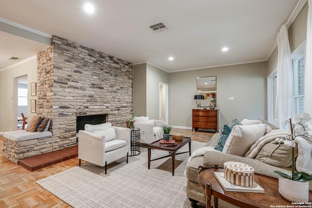 living room featuring a fireplace, ornamental molding, and light parquet floors