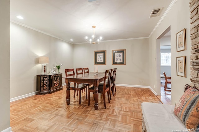 dining area featuring crown molding, light parquet flooring, and a notable chandelier