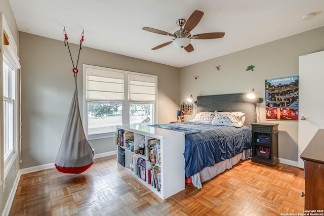 bedroom with ceiling fan and light parquet flooring