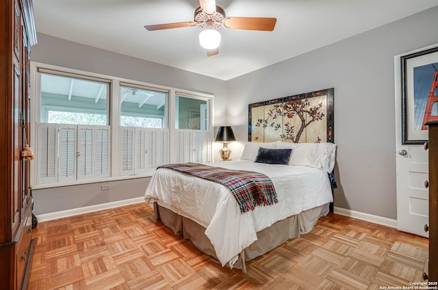 bedroom with ceiling fan and light parquet floors