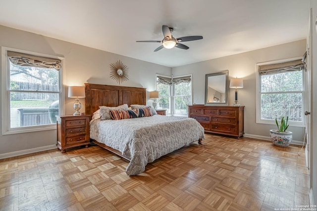 bedroom featuring ceiling fan and light parquet floors