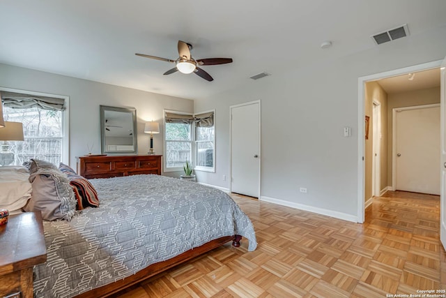 bedroom featuring light parquet floors and ceiling fan