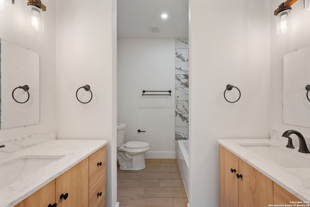 full bathroom featuring vanity, shower / bathtub combination, and toilet