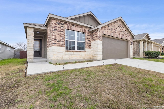 view of front of house featuring a garage and a front lawn