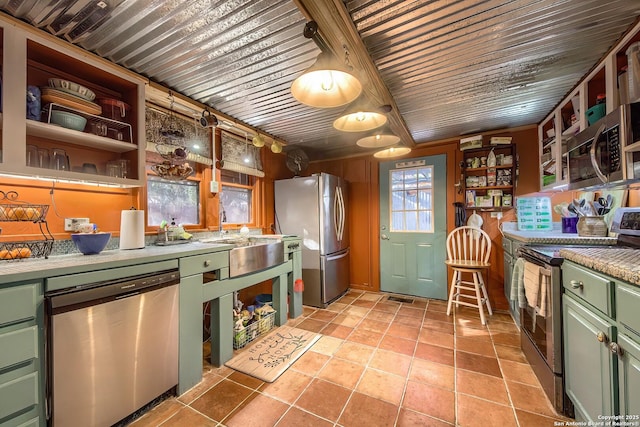 kitchen featuring light tile patterned floors, green cabinets, wooden ceiling, and appliances with stainless steel finishes