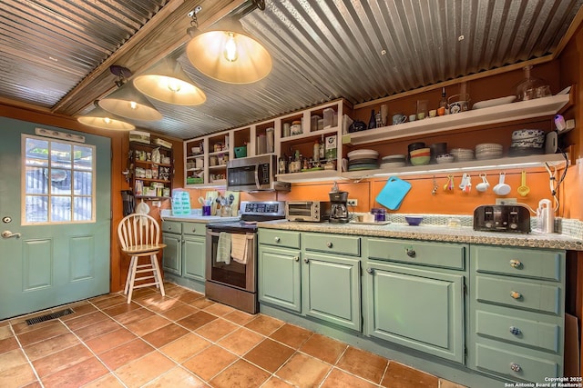 kitchen with light tile patterned flooring, appliances with stainless steel finishes, and wooden ceiling