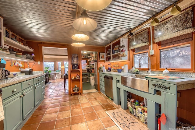 kitchen featuring stainless steel dishwasher, an AC wall unit, sink, and light tile patterned floors