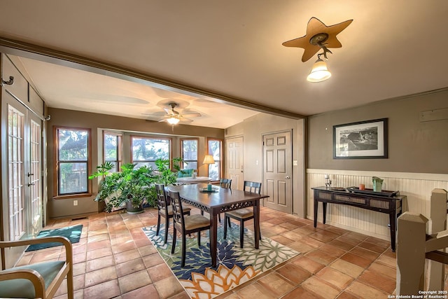 dining space featuring ceiling fan