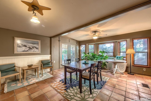 dining area featuring a wealth of natural light, ceiling fan, and french doors