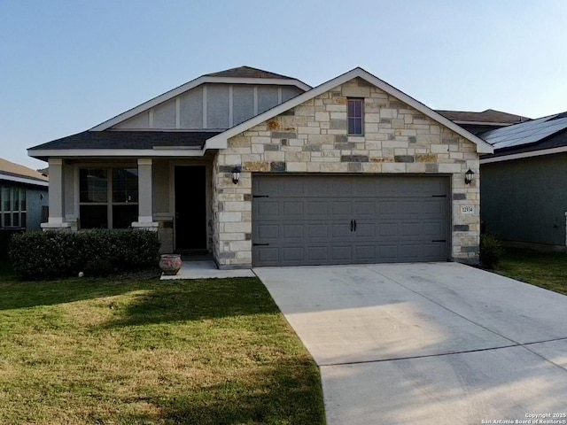 view of front of property featuring a garage and a front yard