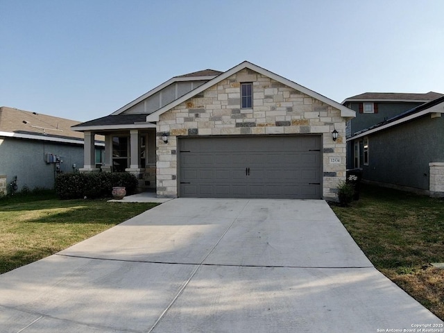 view of front of house featuring a garage and a front yard