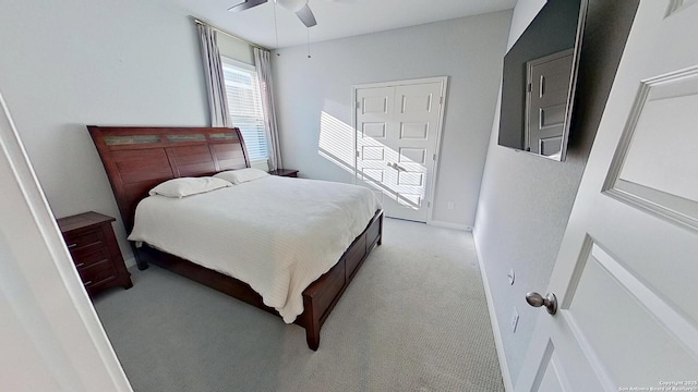 carpeted bedroom featuring ceiling fan